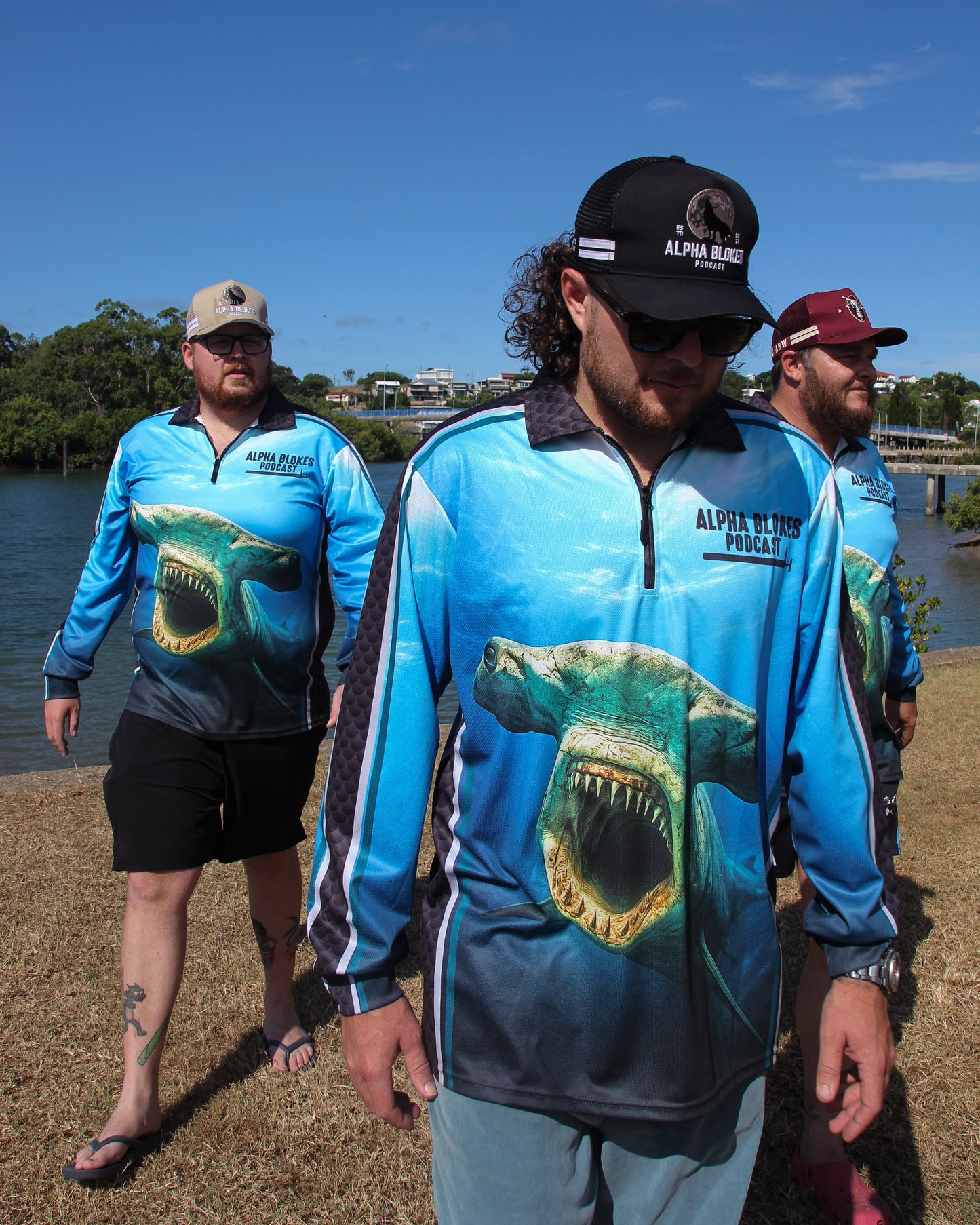 Men walking towards camera all in same blue shirt